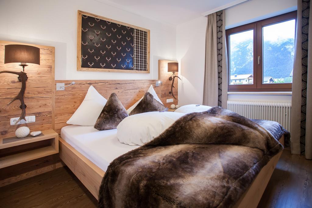 Alpenherz Ferienwohnungen ペルティサウ 部屋 写真